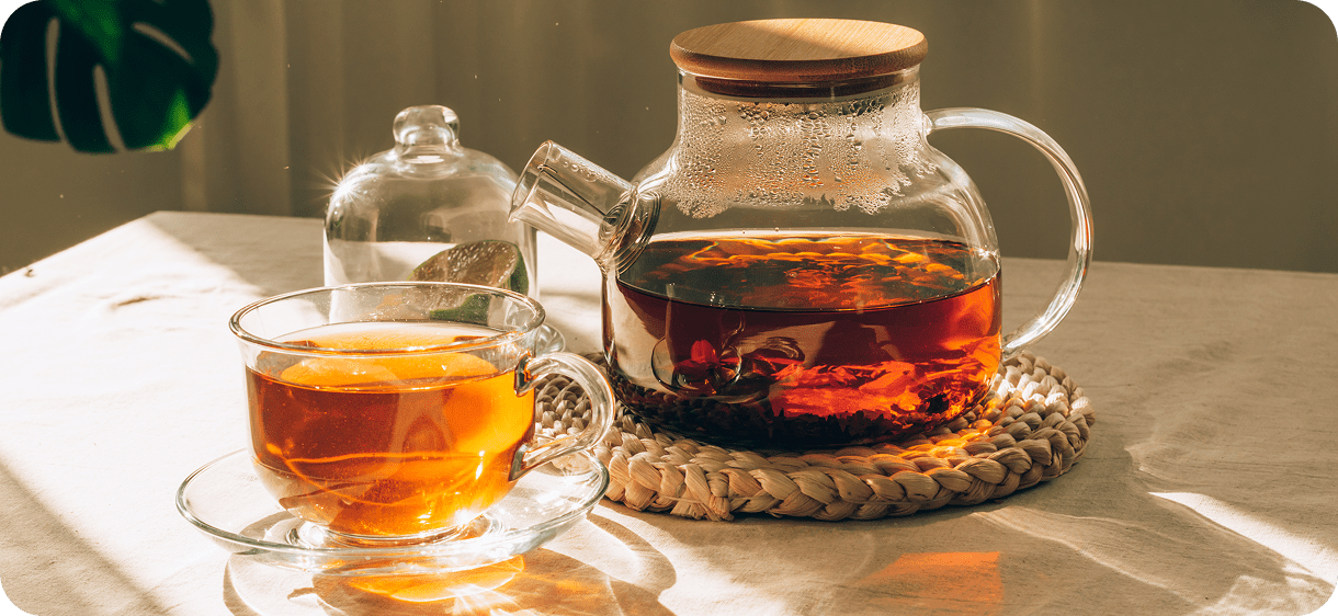 Sunlit herbal tea setup on table