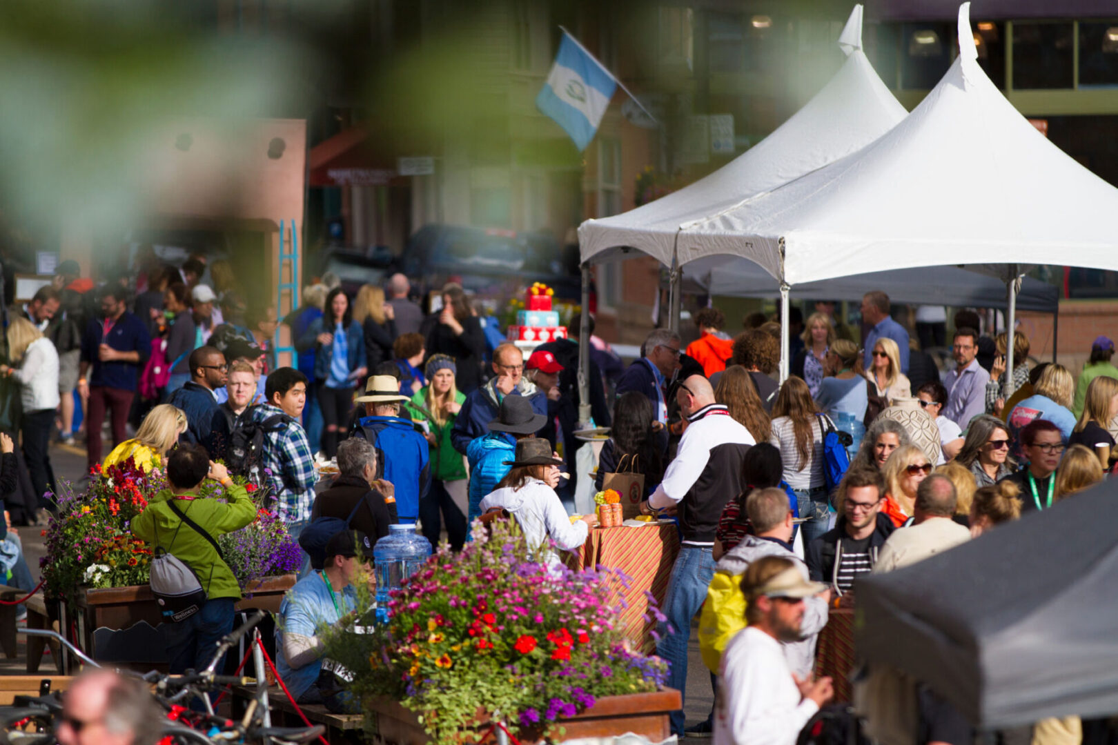 Outdoor market with people and tents
